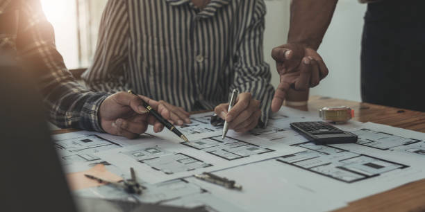 istock Engineer Teamwork Meeting, Drawing working on blueprint meeting for project working with partner on model building and engineering tools in working site, Construction and structure concept. 1443283480