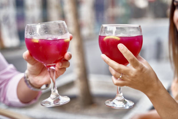 istock Crop couple clinking glasses during date 1443284187