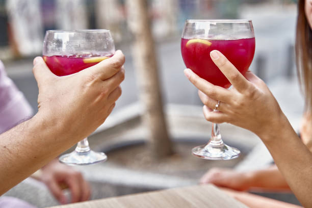 istock Crop couple clinking glasses during date 1443285440