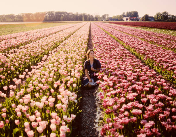 Woman on tulip field in the Netherlands