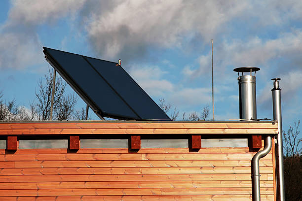 istock Modern house with solar panels for water heating. 144328718
