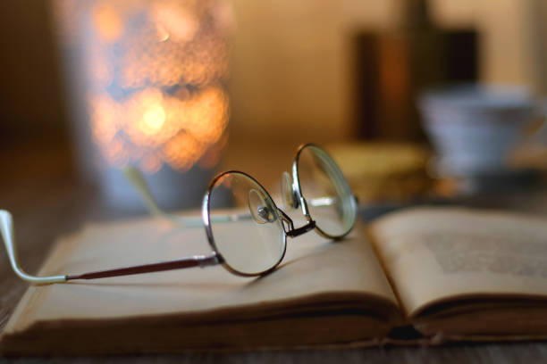 istock Peanut Butter Cookies, Tea, Book, Glasses and Candle 1443287399