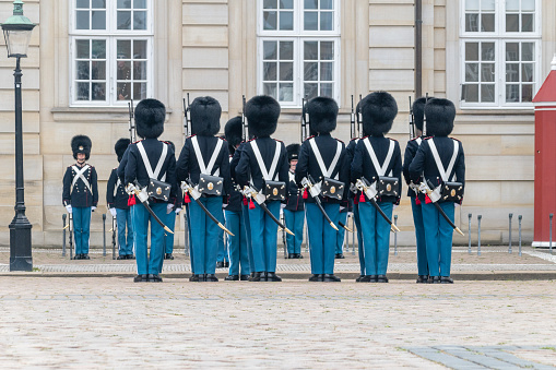 Copenhagen, Denmark - July 26, 2022: Danish Royal Guard changing of the guards at Amalienborg palace in Copenhagen.
