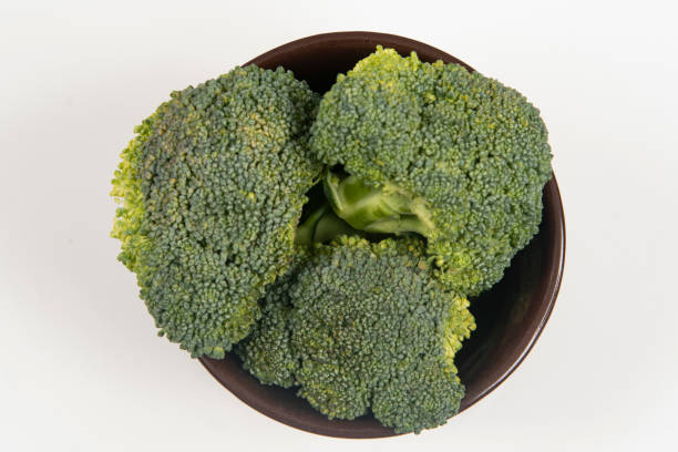 istock Fresh raw broccoli in pot isolated, 1443289174