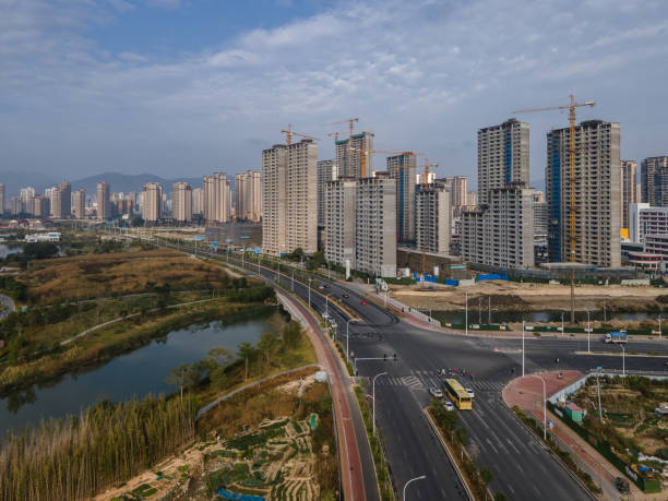 istock Cities by the lakeside and tall buildings under construction 1443289327