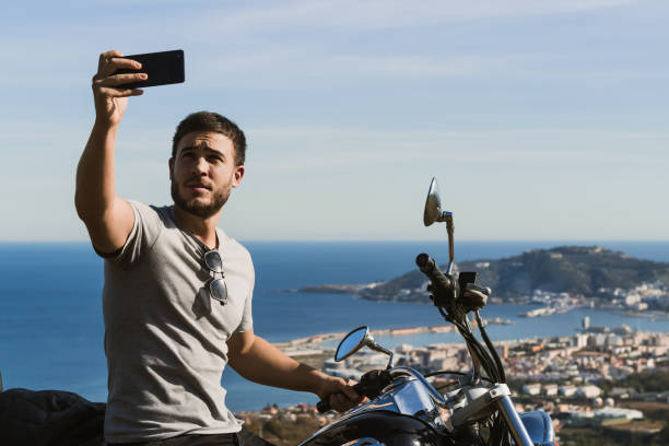 istock Biker taking a selfie with the landscape during a route 1443289762