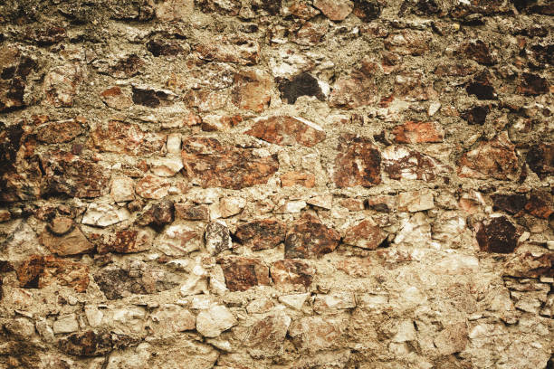 Old stone castle wall texture green tone. Copy space. Wallpaper. Background.