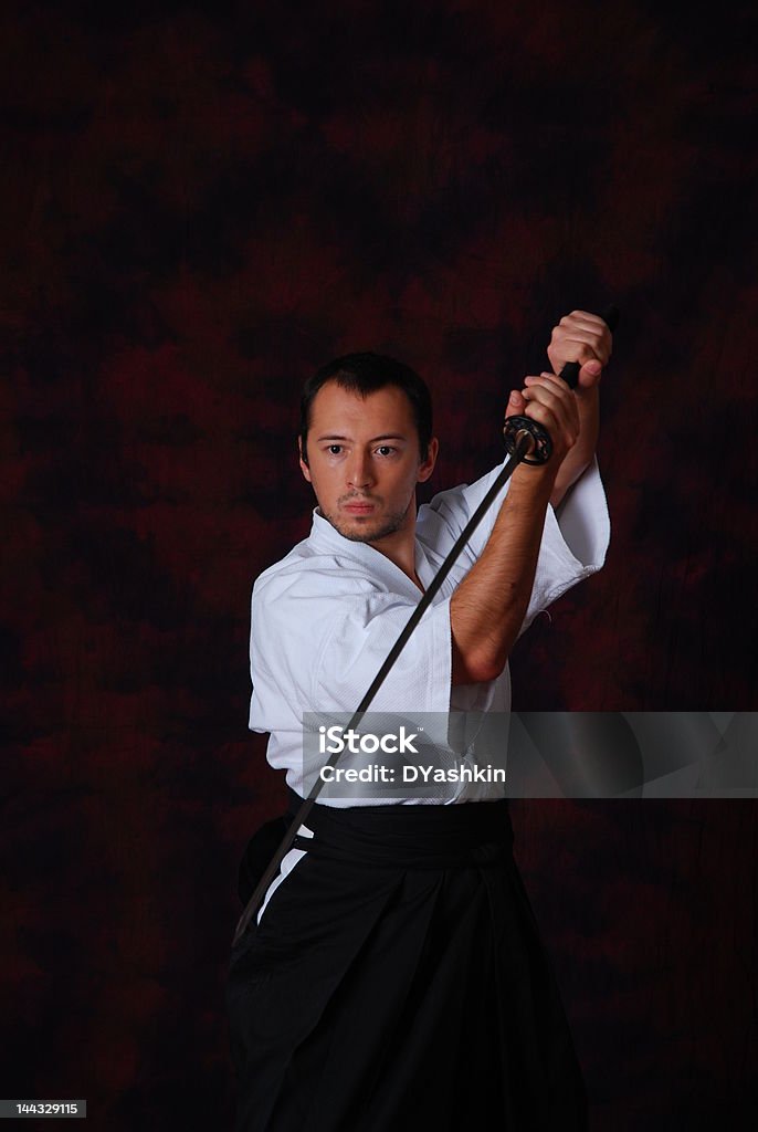 Hombre en blanco con espada - Foto de stock de Adolescente libre de derechos