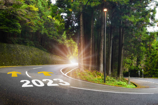 New year 2023 with yellow arrow marking on road surface stock photo