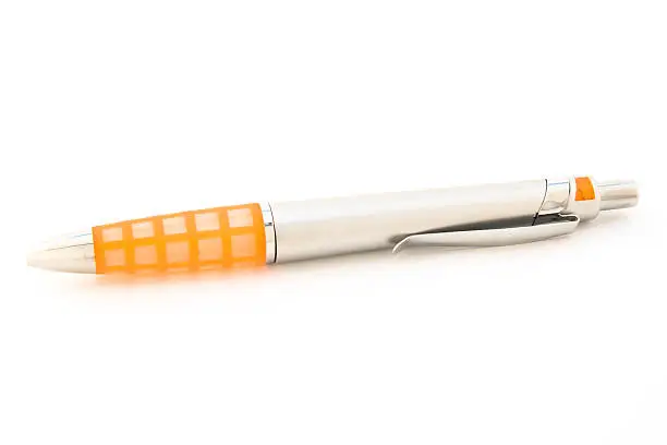 Ballpen with orange details isolated over white background