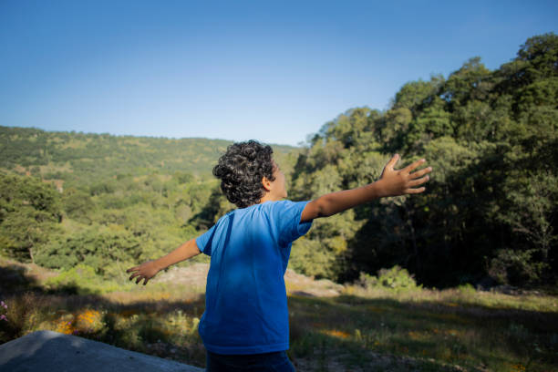 with open arms in the open air