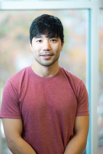 istock Portrait - Looking at Camera - Neutral Background - Relaxed Natural Smile - Confidence 1443292445