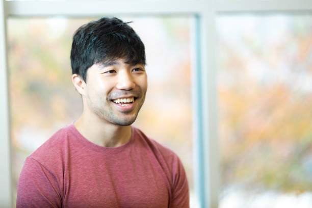 istock Side Portrait - Neutral Background - Relaxed Natural Smile - Confidence - Looking to the Side 1443293497