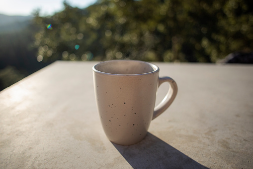 cup on cement table