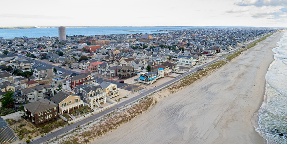 New Jersey Shore resort town, aerial view with city streets looking west from Atlantic Ocean beach toward Barnegat Bay.