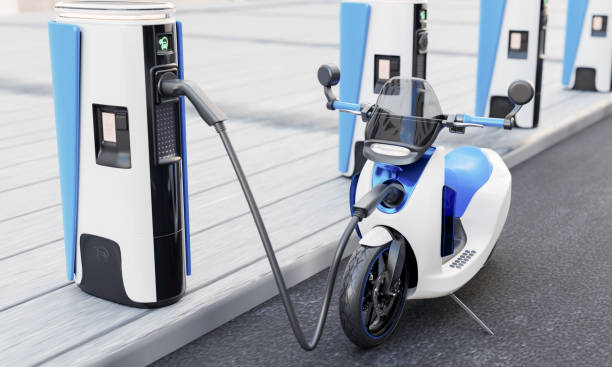 High-speed EV charging station for electric motorcycles on city streets with energy battery charging cable and plug. Innovative power and transportation industry concept. 3D illustration rendering stock photo