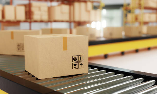 Close-up of cardboard boxes on roller conveyor with storage warehouse background. Business logistics and E-commerce transportation concept. 3D illustration rendering