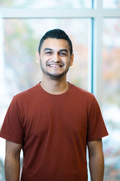 istock Portrait - Looking at Camera - Neutral Background - Relaxed Natural Smile - Confidence 1443295763