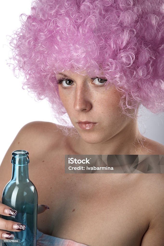 girl in pink girl in pink dress and wig with blue bottle Adult Stock Photo