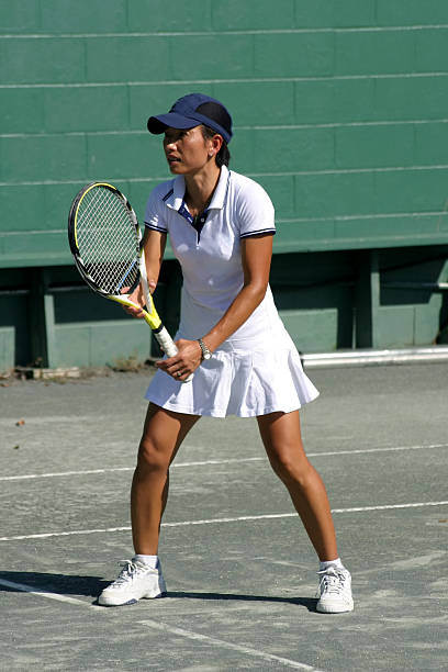 ethnic female tennis player waiting for serve