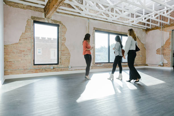 istock Unrecognizable businesswomen walk through empty office space for sale 1443298770