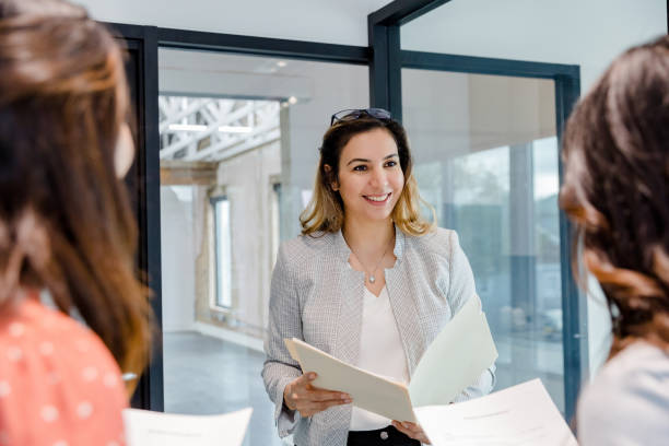 istock After viewing office loft, broker and clients discuss rental agreement 1443298783