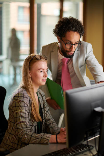 istock young business graduate with supervisor 1443301328