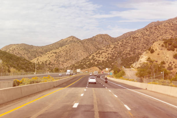 Curving highway in desert mountains, Arizona