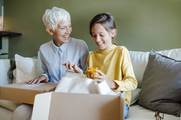 istock Excitement of opening the box with an online order 1443301626