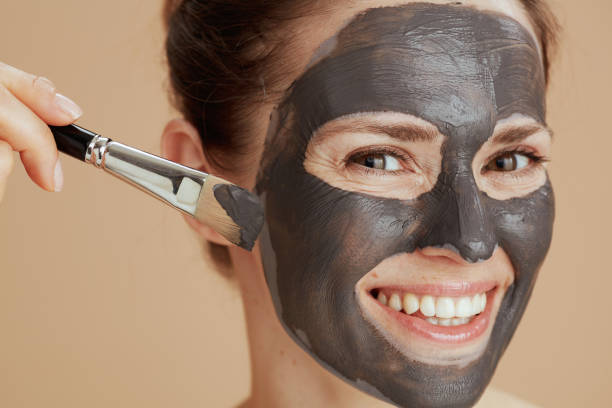 istock happy modern female with brush and cosmetic mask 1443301699