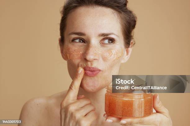 Happy Modern Woman With Face Scrub Stock Photo - Download Image Now - Exfoliation, Human Lips, Human Face