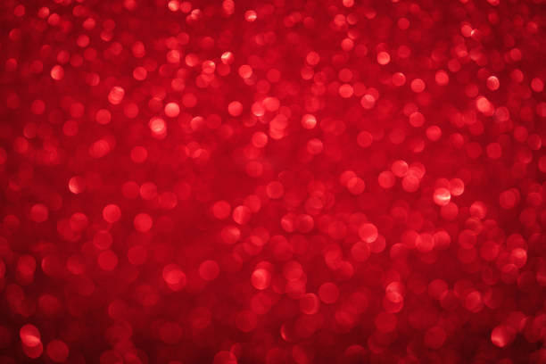 Red bokeh lights background. Unfocused abstract red glitter holiday background. Christmas, Valentines day design element. Mock up. Winter xmas holidays wallpaper. stock photo