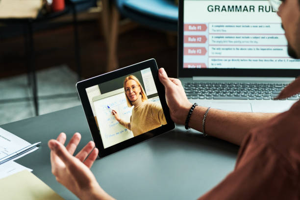istock Confident blond tutor presenting new English grammar subject 1443305520