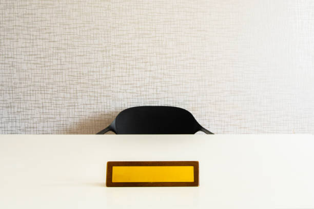 Empty name space on yellow office plate on white table with chair. Vector realistic mockup of wooden office white table with blank office plate,identification or nameplate isolated