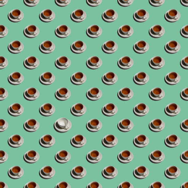 Pattern with lonely cup of tea and many empty cups on mint color background