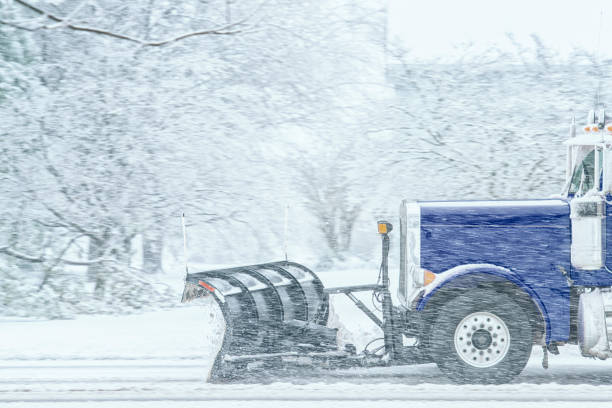 istock A blue dump truck with snowplow clearing county roads 1443314786