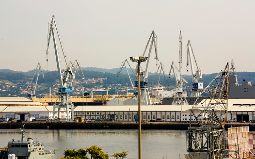 Harbor cranes in Ferrol, A Coruña province, Galicia, Spain. View of large harbor, ría de Ferrol.