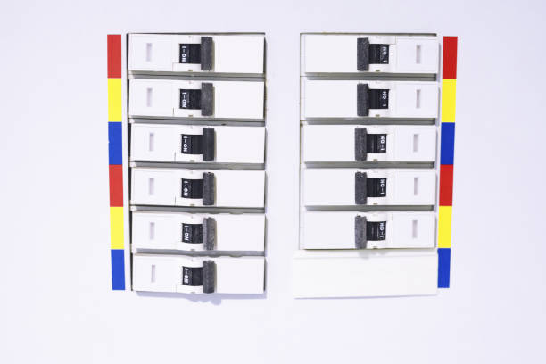 Person resetting the circuit breaker at the electrical panel