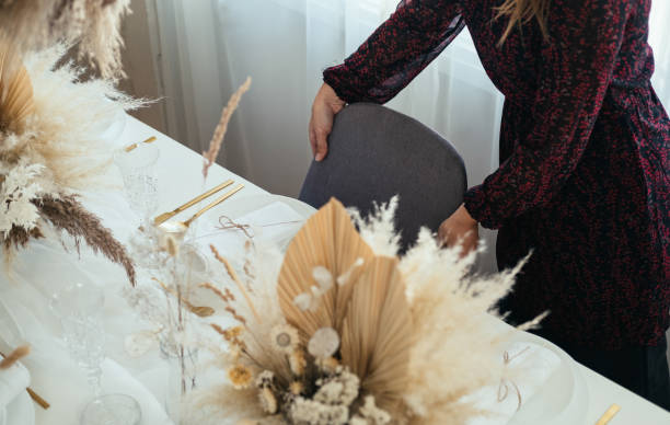 istock Christmas Preparation: An Anonymous Woman Setting Up Christmas Dinner Table 1443318131