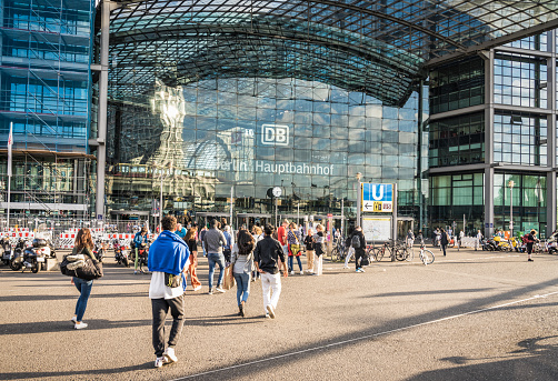 Berlin, Germany - People walking towards the main entrance to Berlin Hauptbahnhof, the city's main train station.