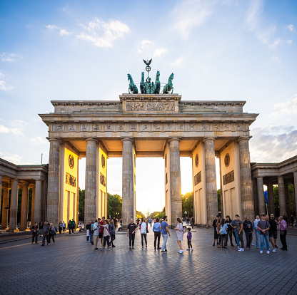 View of the illuminated Brandenburg Gate in Berlin at the Blue Hour just before dark.