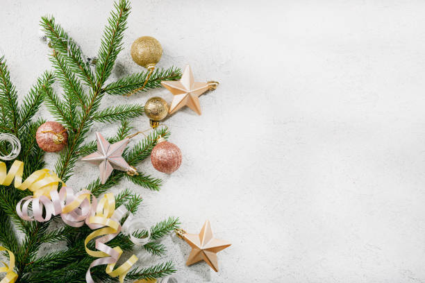 istock Light Christmas holiday background with green branches decor copy space 1443320081