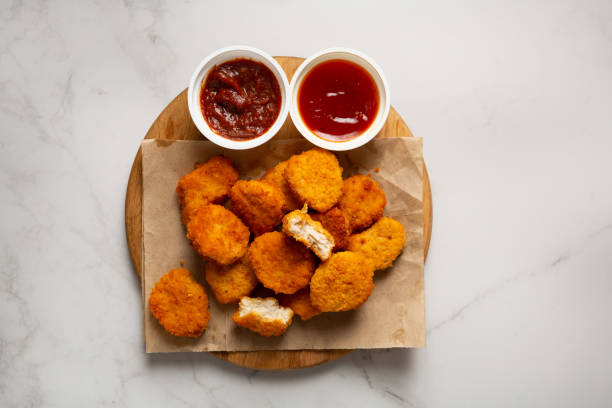 istock Top view of nuggets and bbq dips marble surface fast food 1443320669