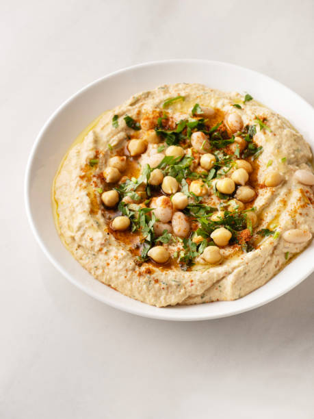 istock Chickpea hummus bowl closeup, Creamy Hummus,  Hummus, White Bean Dip 1443320863