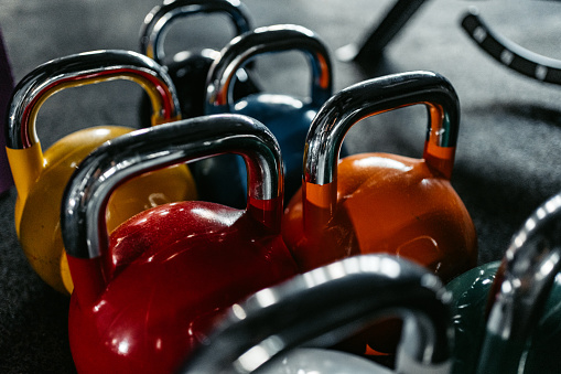 Close-up of different sized kettlebells at the gym.