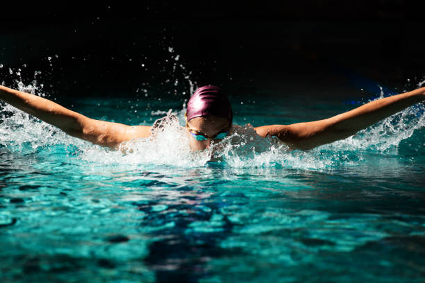 istock Young woman swimmer training in the pool. 1443321570