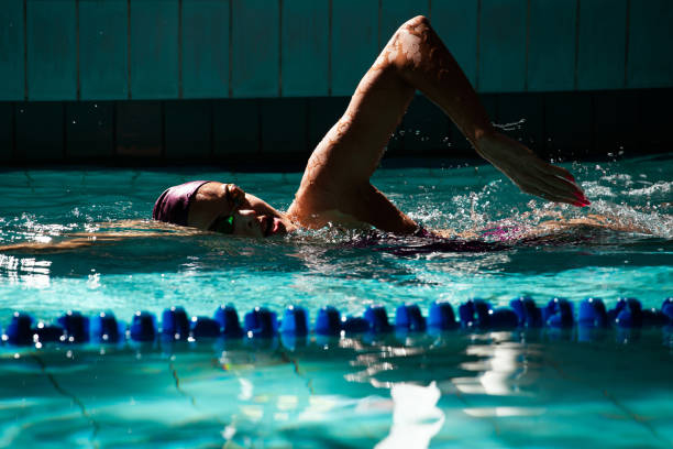 istock Young woman swimmer training in the pool. 1443322108