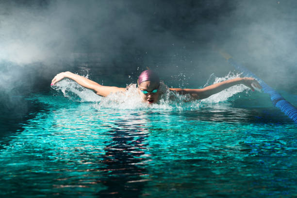 istock Young woman swimmer training in the pool. 1443322423