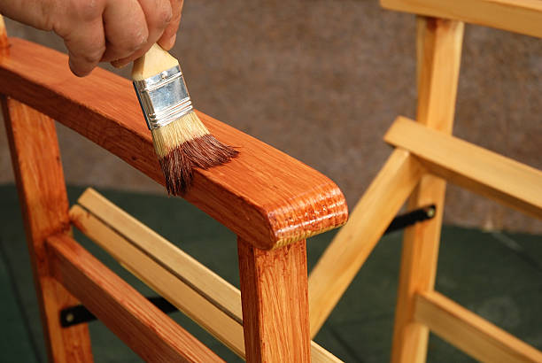 istock painting a chair with brush 144332245