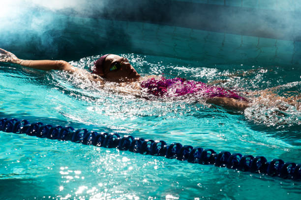 istock Young woman swimmer training in the pool. 1443322630